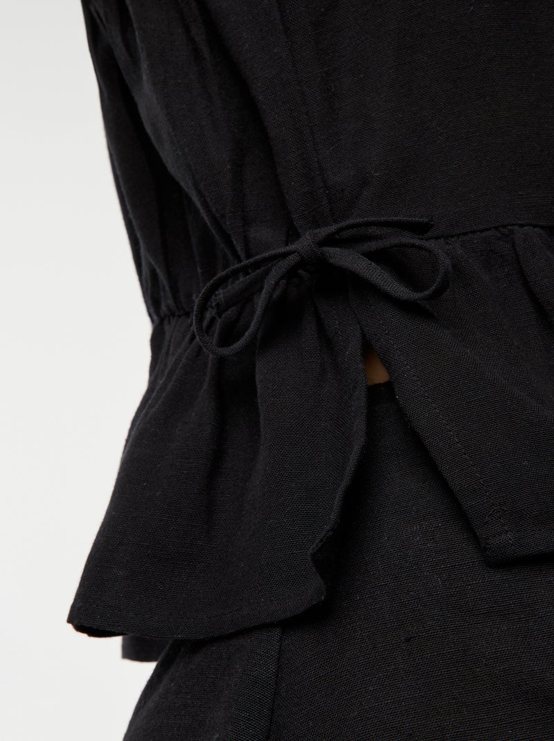 Débardeur à fines bretelles et motif noir - Kiabi