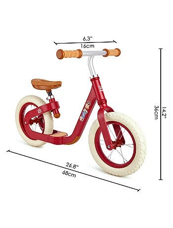 Draisienne rouge en métal avec repose pieds et assise en liège Hape