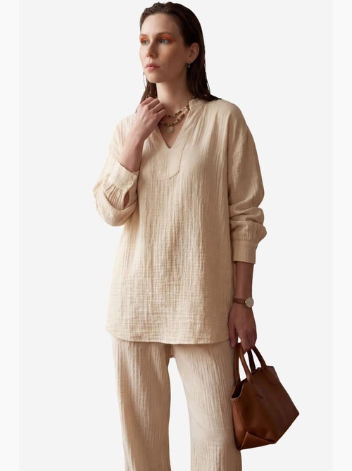 Ensemble coordonné deux pièces à jambes larges et col en v boutonné my fashion - Kiabi Ensemble coordonné deux pièces à jambes larges et col en v boutonné my fashion - Kiabi