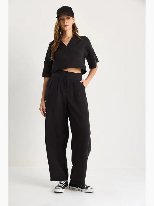 Ensemble coordonné deux pièces en maille à col v et pantalon à jambes larges lucci - Kiabi Ensemble coordonné deux pièces en maille à col v et pantalon à jambes larges lucci - Kiabi