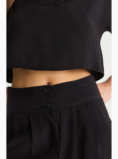 Ensemble coordonné deux pièces en maille à col v et pantalon à jambes larges lucci - Kiabi Ensemble coordonné deux pièces en maille à col v et pantalon à jambes larges lucci - Kiabi