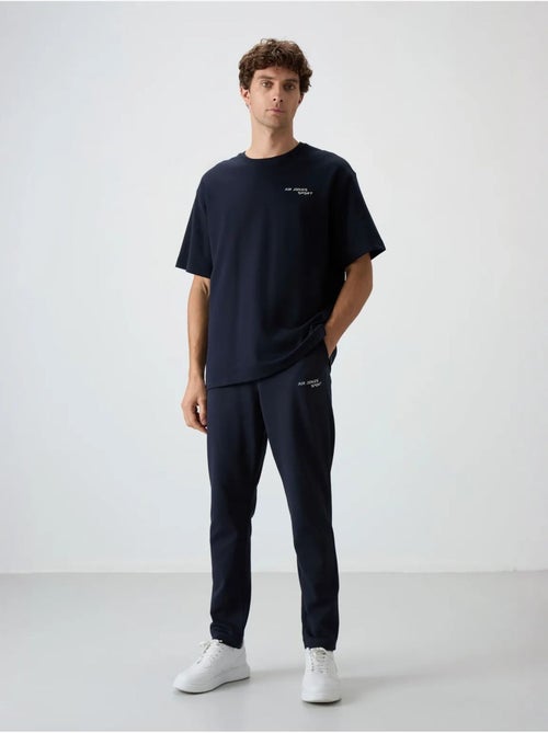 Ensemble de sport homme oversize en coton mélangé tommy - Kiabi Ensemble de sport homme oversize en coton mélangé tommy - Kiabi