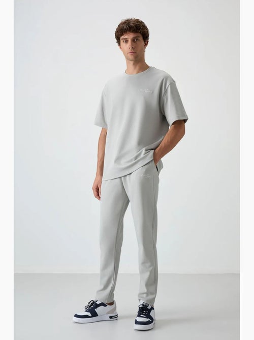 Ensemble de sport homme oversize en coton mélangé tommy - Kiabi Ensemble de sport homme oversize en coton mélangé tommy - Kiabi