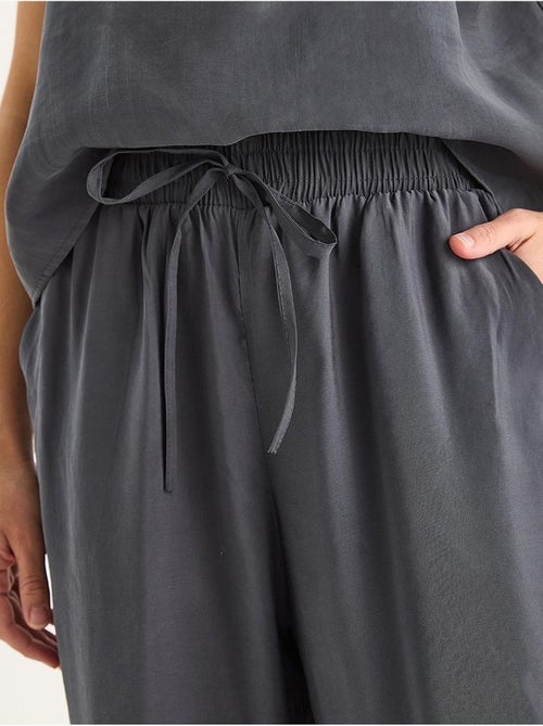 Ensemble débardeur sans manches et pantalon large lucci - Kiabi Ensemble débardeur sans manches et pantalon large lucci - Kiabi
