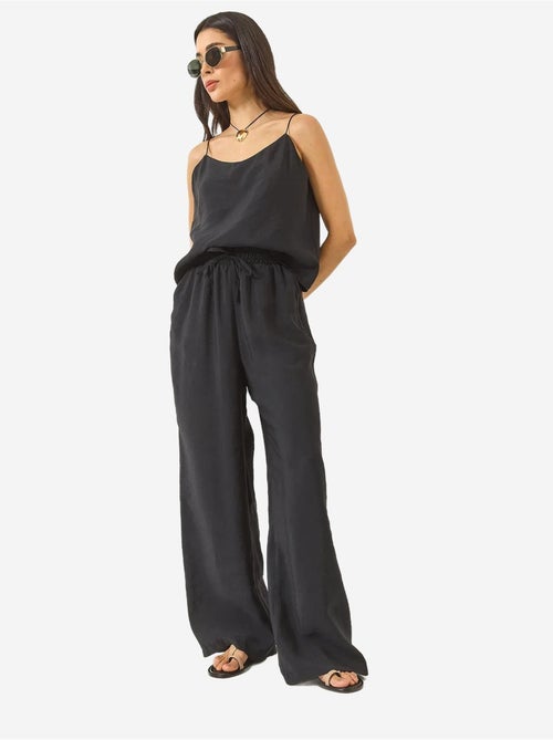 Ensemble débardeur sans manches et pantalon large lucci - Kiabi Ensemble débardeur sans manches et pantalon large lucci - Kiabi