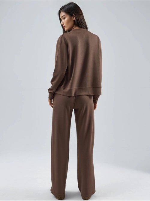 Ensemble deux pièces à capuche, taille haute et jambes larges hiccup - Kiabi Ensemble deux pièces à capuche, taille haute et jambes larges hiccup - Kiabi