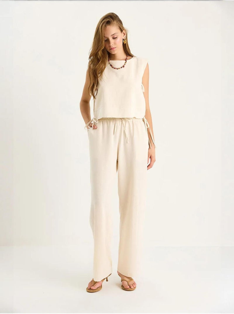 Ensemble deux pièces à col ras du cou et fermeture à nouer avec pantalon large lucci Beige argile - Kiabi