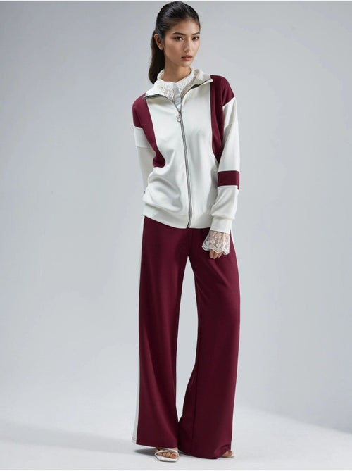 Ensemble deux pièces à jambes larges et col zippé color block hiccup - Kiabi Ensemble deux pièces à jambes larges et col zippé color block hiccup - Kiabi