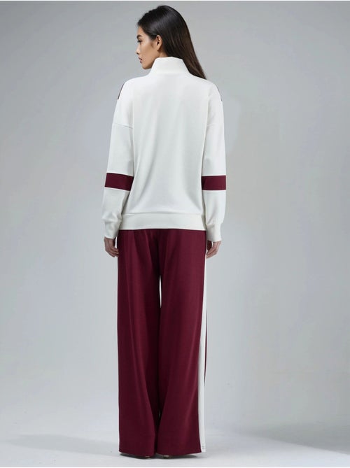 Ensemble deux pièces à jambes larges et col zippé color block hiccup - Kiabi Ensemble deux pièces à jambes larges et col zippé color block hiccup - Kiabi
