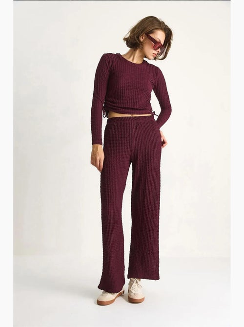 Ensemble deux pièces ajusté avec pantalon évasé lucci - Kiabi Ensemble deux pièces ajusté avec pantalon évasé lucci - Kiabi