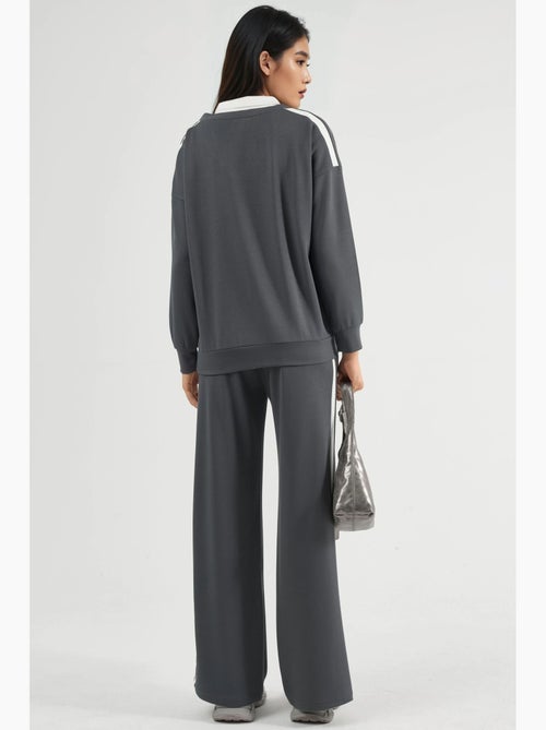 Ensemble deux pièces coordonné à col zippé et jambes larges hiccup - Kiabi Ensemble deux pièces coordonné à col zippé et jambes larges hiccup - Kiabi