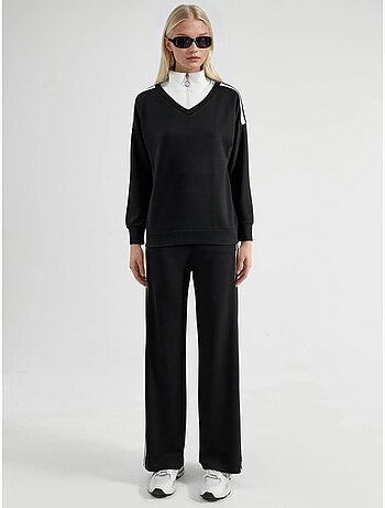 Ensemble deux pièces coordonné à col zippé et jambes larges