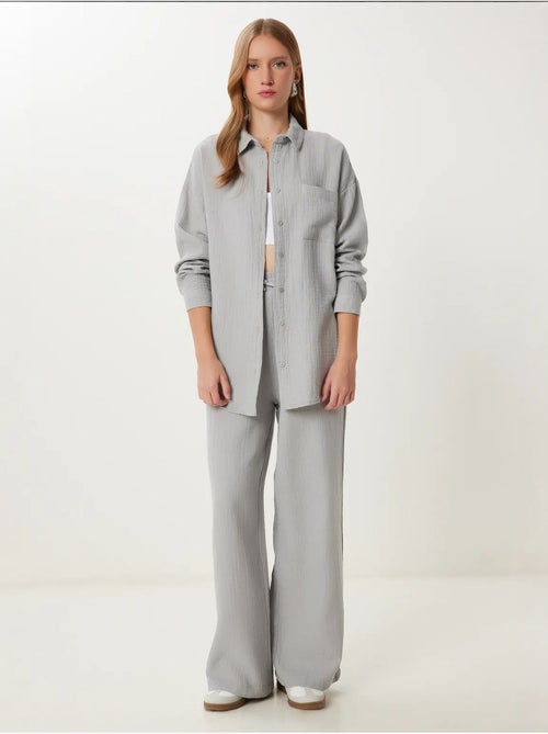 Ensemble deux pièces coordonné à taille haute, jambe large et col chemise istanbul - Kiabi Ensemble deux pièces coordonné à taille haute, jambe large et col chemise istanbul - Kiabi