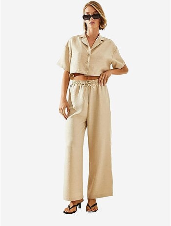 Ensemble deux pièces haut court à col veste et pantalon boutonné à poches lucci