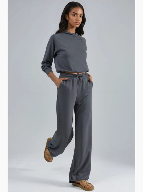 Ensemble deux pièces taille haute à col roulé et jambes larges hiccup - Kiabi Ensemble deux pièces taille haute à col roulé et jambes larges hiccup - Kiabi