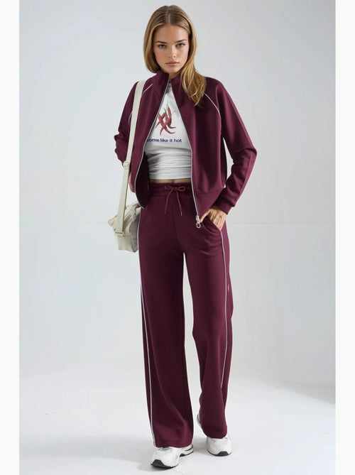 Ensemble deux pièces taille haute jambes larges avec col zippé hiccup - Kiabi Ensemble deux pièces taille haute jambes larges avec col zippé hiccup - Kiabi
