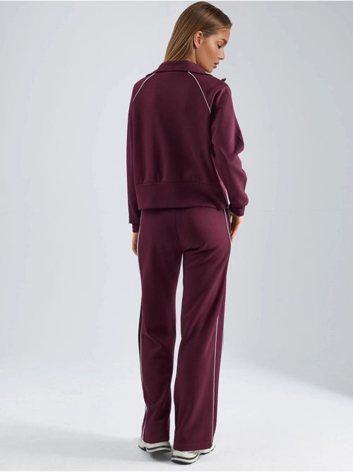 Ensemble deux pièces taille haute jambes larges avec col zippé hiccup - Kiabi Ensemble deux pièces taille haute jambes larges avec col zippé hiccup - Kiabi