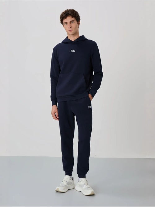 Ensemble homme sweat à capuche et pantalon tommy - Kiabi Ensemble homme sweat à capuche et pantalon tommy - Kiabi