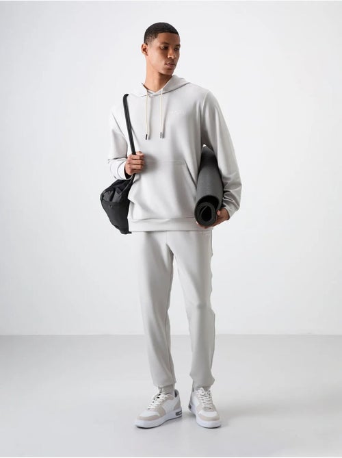 Ensemble homme sweat à capuche et pantalon tommy - Kiabi Ensemble homme sweat à capuche et pantalon tommy - Kiabi