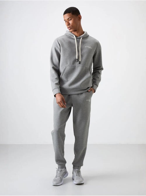 Ensemble homme sweat à capuche et pantalon tommy - Kiabi Ensemble homme sweat à capuche et pantalon tommy - Kiabi