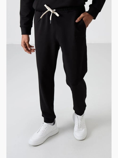 Ensemble homme sweat à capuche et pantalon tommy - Kiabi Ensemble homme sweat à capuche et pantalon tommy - Kiabi