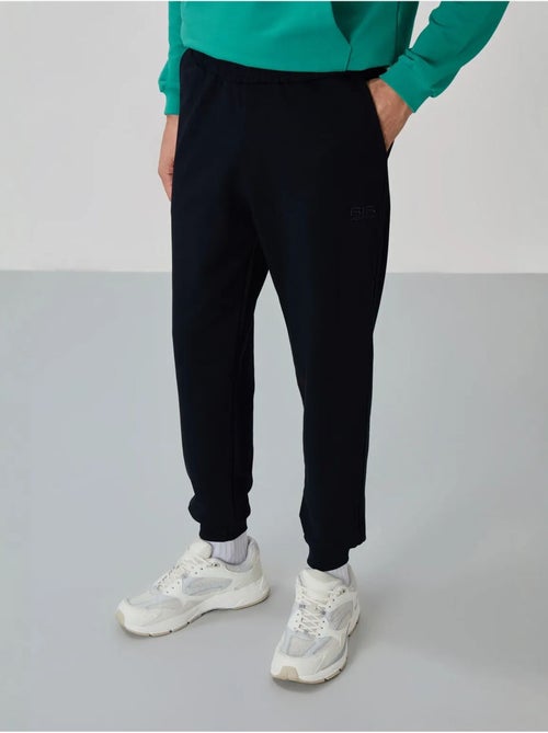 Ensemble homme sweat et pantalon à fermeture éclair tommy - Kiabi Ensemble homme sweat et pantalon à fermeture éclair tommy - Kiabi