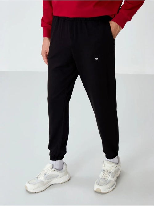 Ensemble homme sweat et pantalon oversize tommy - Kiabi Ensemble homme sweat et pantalon oversize tommy - Kiabi