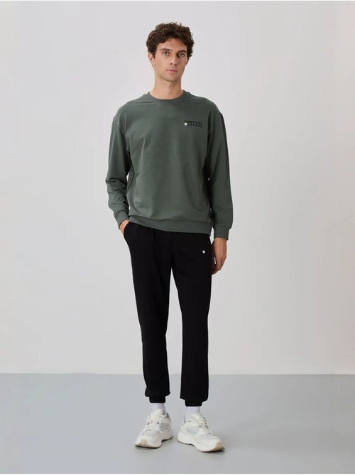 Ensemble homme sweat et pantalon oversize tommy - Kiabi Ensemble homme sweat et pantalon oversize tommy - Kiabi