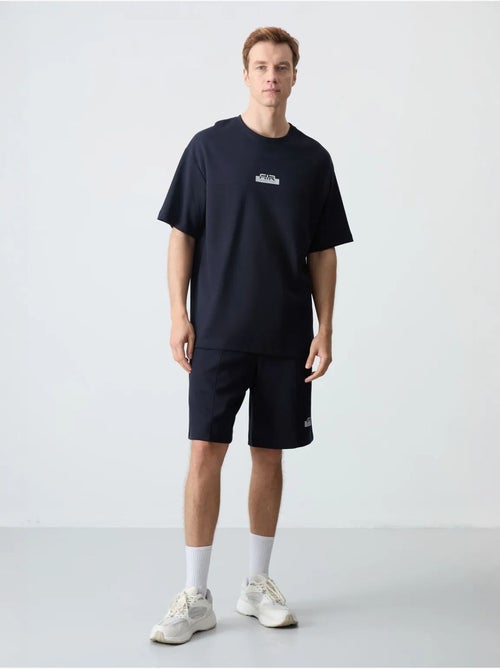 Ensemble homme t-shirt et short oversize tommy - Kiabi Ensemble homme t-shirt et short oversize tommy - Kiabi