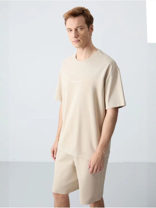 Ensemble homme t-shirt oversize et short en coton mélangé tommy - Kiabi Ensemble homme t-shirt oversize et short en coton mélangé tommy - Kiabi