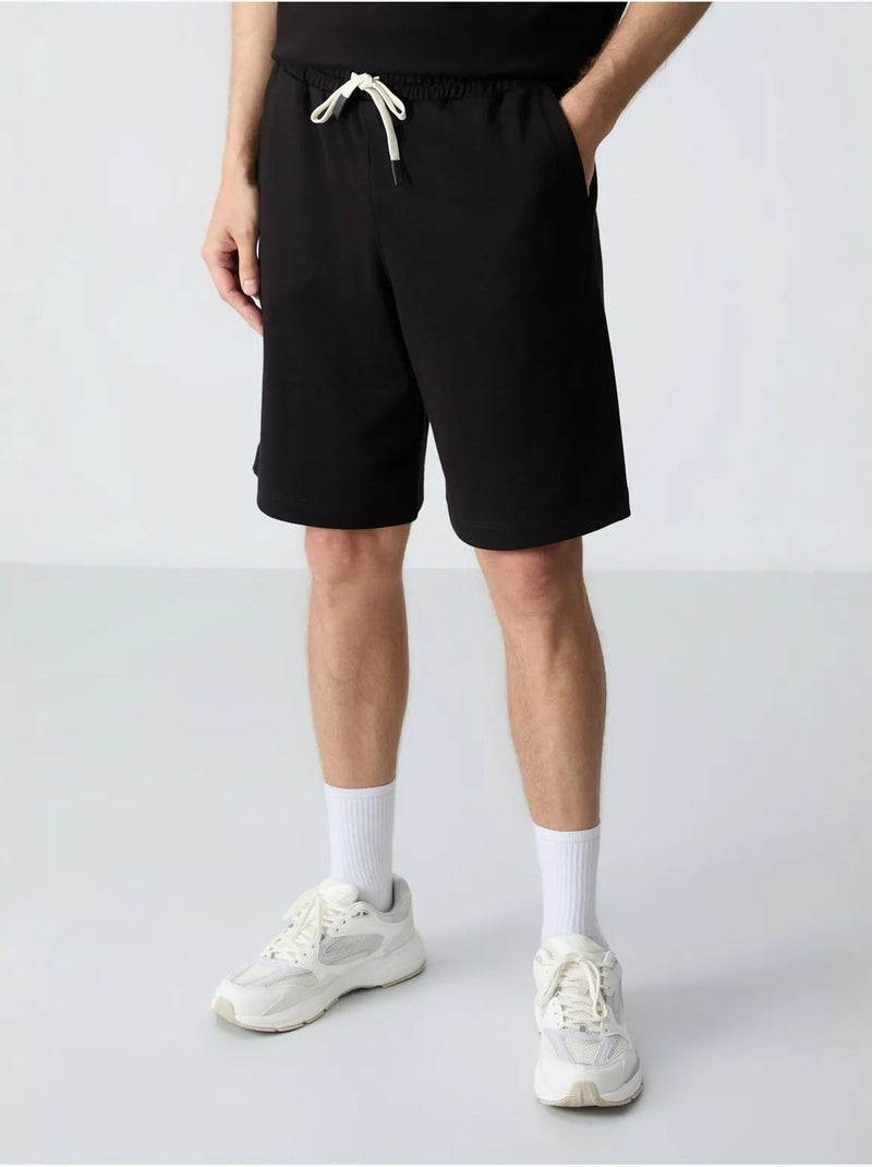 Ensemble homme t-shirt oversize et short en coton mélangé tommy Noir - Kiabi
