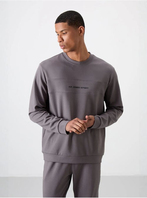 Ensemble sweat et pantalon en molleton imprimé tommy - Kiabi Ensemble sweat et pantalon en molleton imprimé tommy - Kiabi