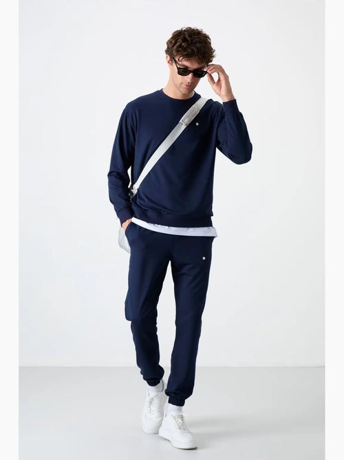 Ensemble sweat et pantalon oversize col rond tommy - Kiabi Ensemble sweat et pantalon oversize col rond tommy - Kiabi