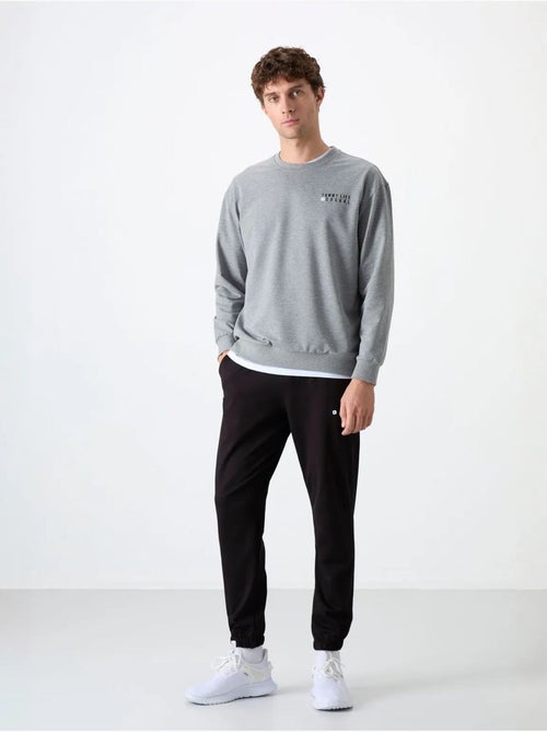 Ensemble sweat et pantalon oversize col rond tommy - Kiabi Ensemble sweat et pantalon oversize col rond tommy - Kiabi
