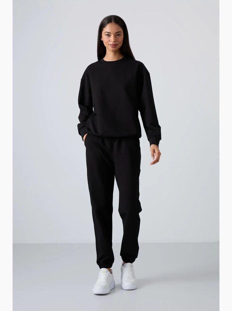 Ensemble sweat-shirt et pantalon oversize à col rond tommy Noir - Kiabi