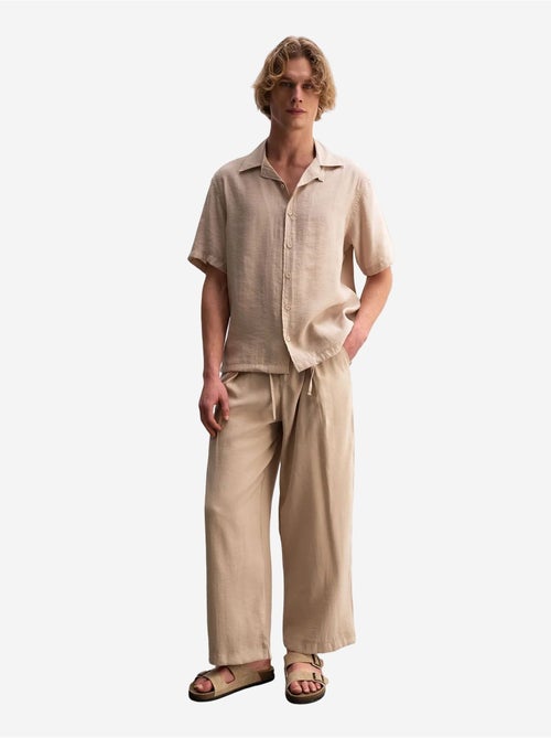 Giesto chemise tissée à manches courtes coupe décontractée avec détail nouée - Kiabi Giesto chemise tissée à manches courtes coupe décontractée avec détail nouée - Kiabi