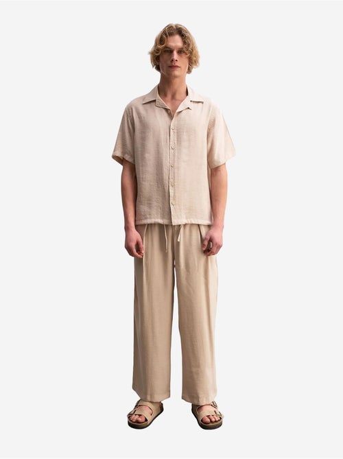 Giesto chemise tissée à manches courtes coupe décontractée avec détail nouée - Kiabi Giesto chemise tissée à manches courtes coupe décontractée avec détail nouée - Kiabi