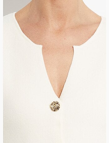 Gilet à basques avec boutons métallisés