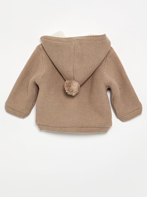 Gilet au point mousse doublé à capuche - Kiabi Gilet au point mousse doublé à capuche - Kiabi