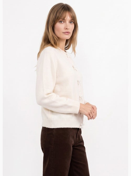 Gilet avec détails n¿ud perles de rocaille - afibel - Kiabi Gilet avec détails n¿ud perles de rocaille - afibel - Kiabi