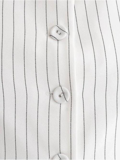 Gilet boutonné à col rond rayé - Kiabi Gilet boutonné à col rond rayé - Kiabi