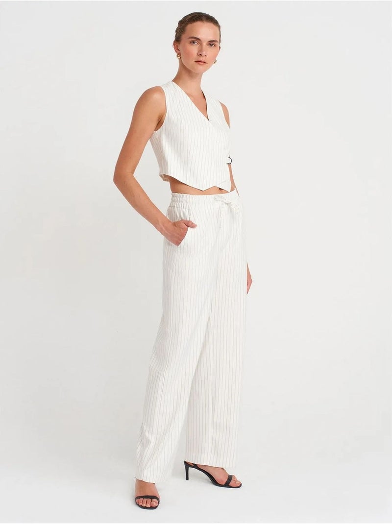 Gilet court rayé pour femme avec ceinture dilvin Blanc - Kiabi