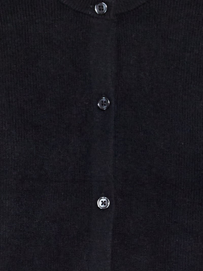 Gilet en maille avec poignets volantés noir - Kiabi