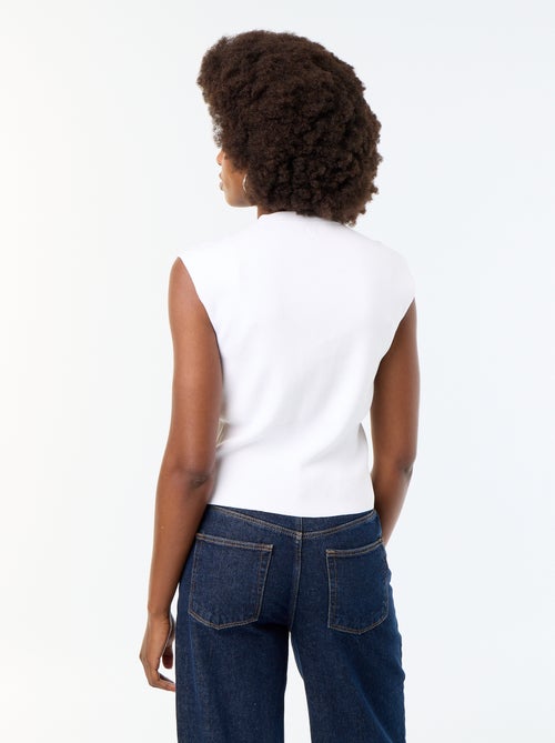 Gilet sans manches avec boutons dorés - Kiabi Gilet sans manches avec boutons dorés - Kiabi