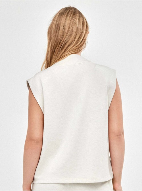 Gilet sportif double doux avec fermeture éclair frontale en couleur beige - Kiabi Gilet sportif double doux avec fermeture éclair frontale en couleur beige - Kiabi