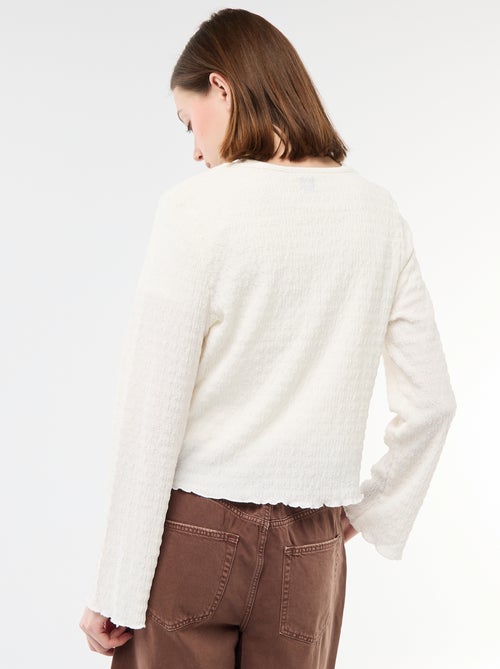 Haut col V en maille gaufrée avec boutons dorés - Kiabi Haut col V en maille gaufrée avec boutons dorés - Kiabi