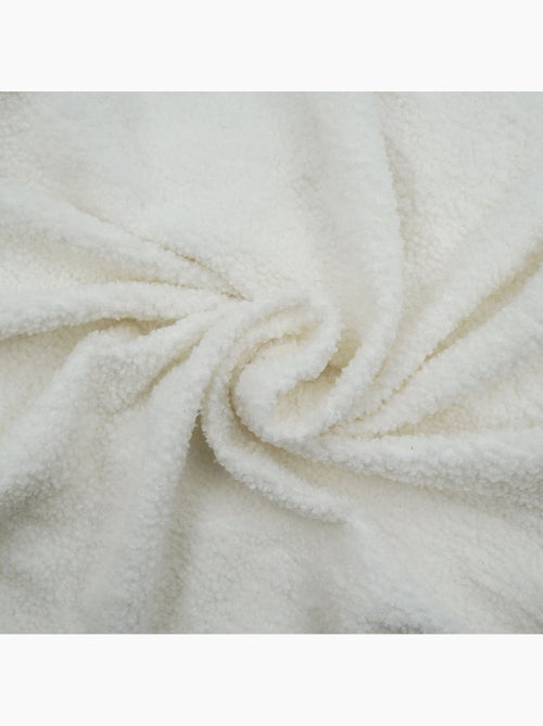 Housse de canapé extensible en bouclette - Kiabi Housse de canapé extensible en bouclette - Kiabi