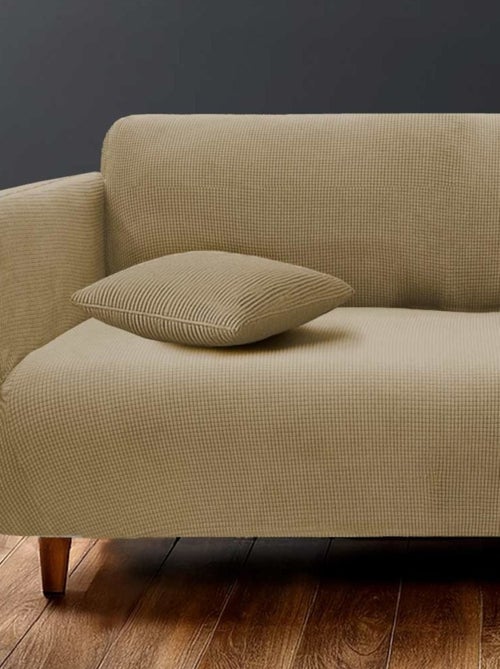 Housse de canapé extensible en polyester gaufré coloris beige - Kiabi Housse de canapé extensible en polyester gaufré coloris beige - Kiabi