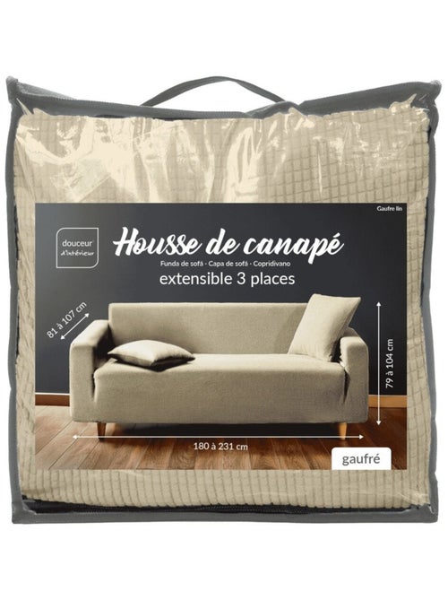 Housse de canapé extensible en polyester gaufré coloris beige - Kiabi Housse de canapé extensible en polyester gaufré coloris beige - Kiabi