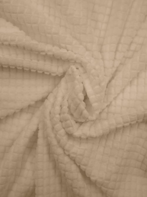 Housse de canapé extensible en polyester gaufré coloris beige - Kiabi Housse de canapé extensible en polyester gaufré coloris beige - Kiabi